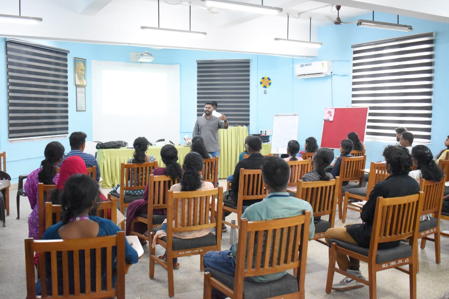 A facilitator speaking to students during a career guidance session