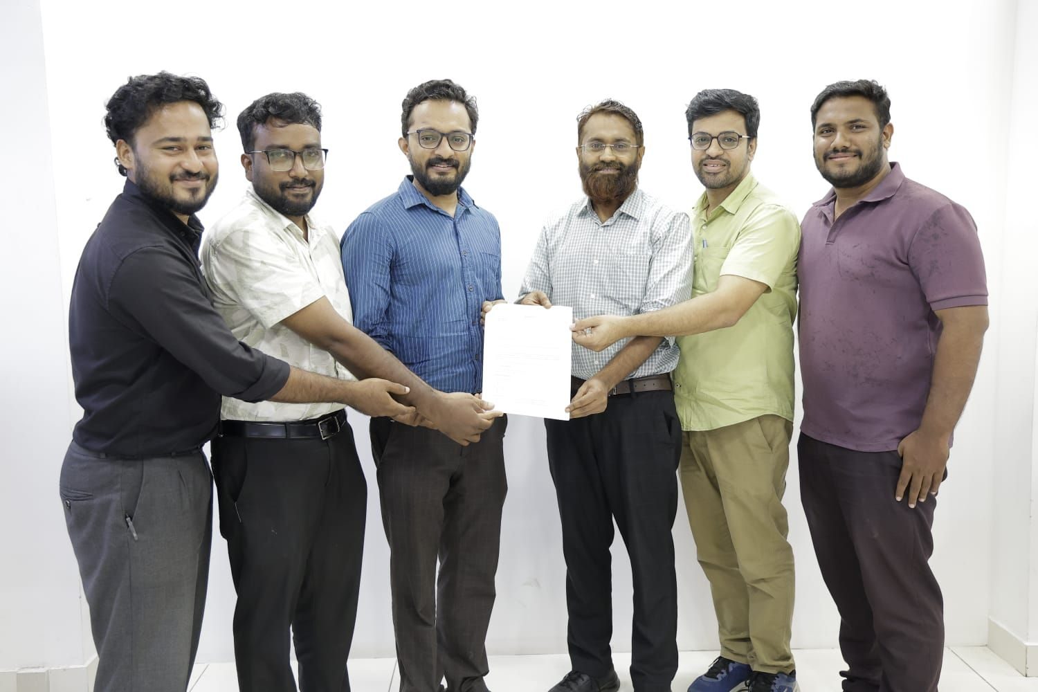 The NPoC and Circle of Kindness teams with their partnership agreement