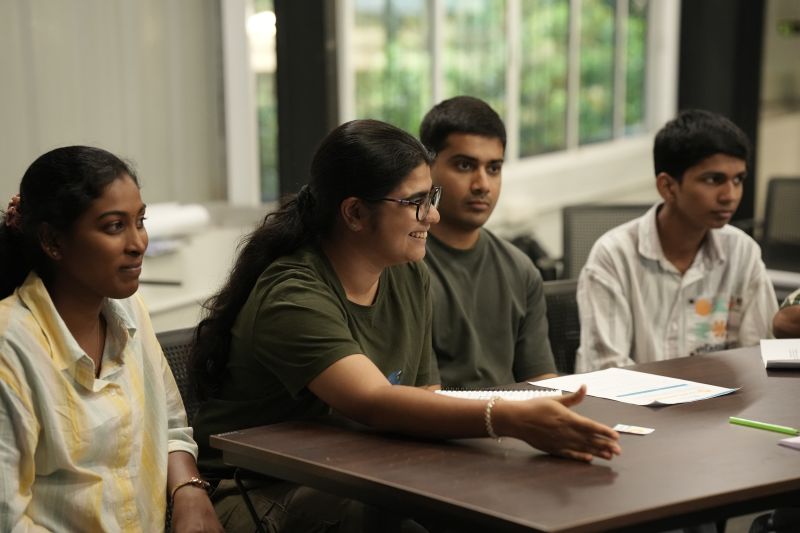 Participants discuss their group's position during the game