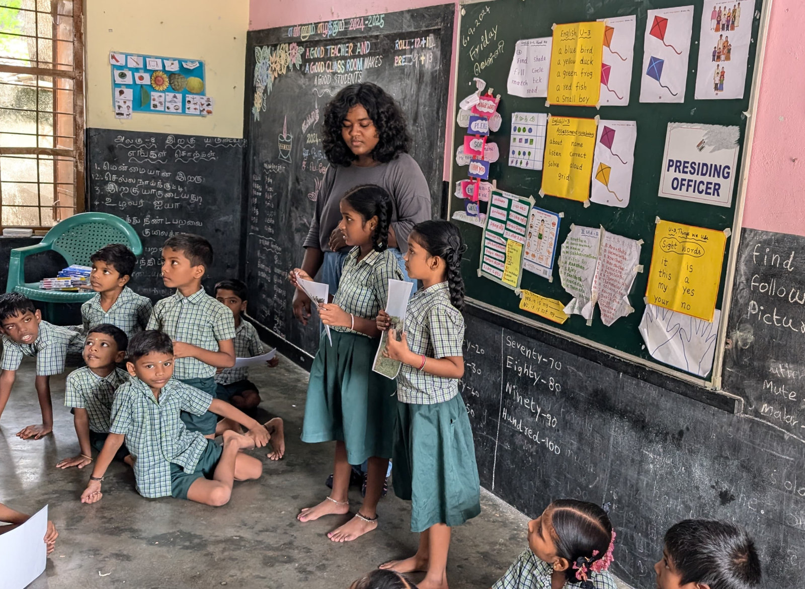 Students present their charts in a classroom in Singaperumal Koil